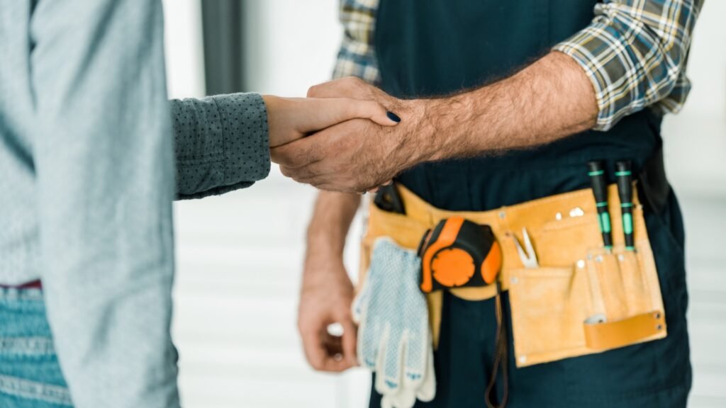 shaking hands with customer after gas boiler service