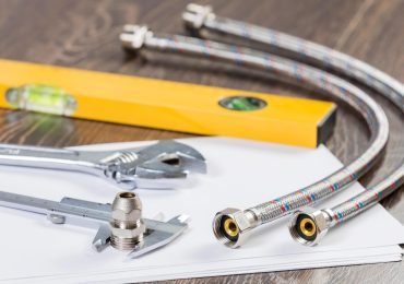 underfloor heating system installation tools on wooden floor