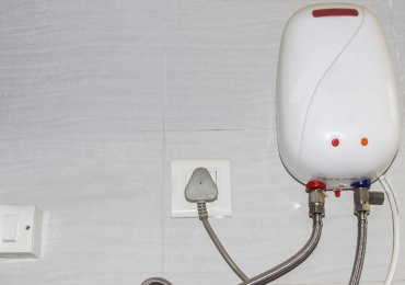 white oil boiler water heater on wall